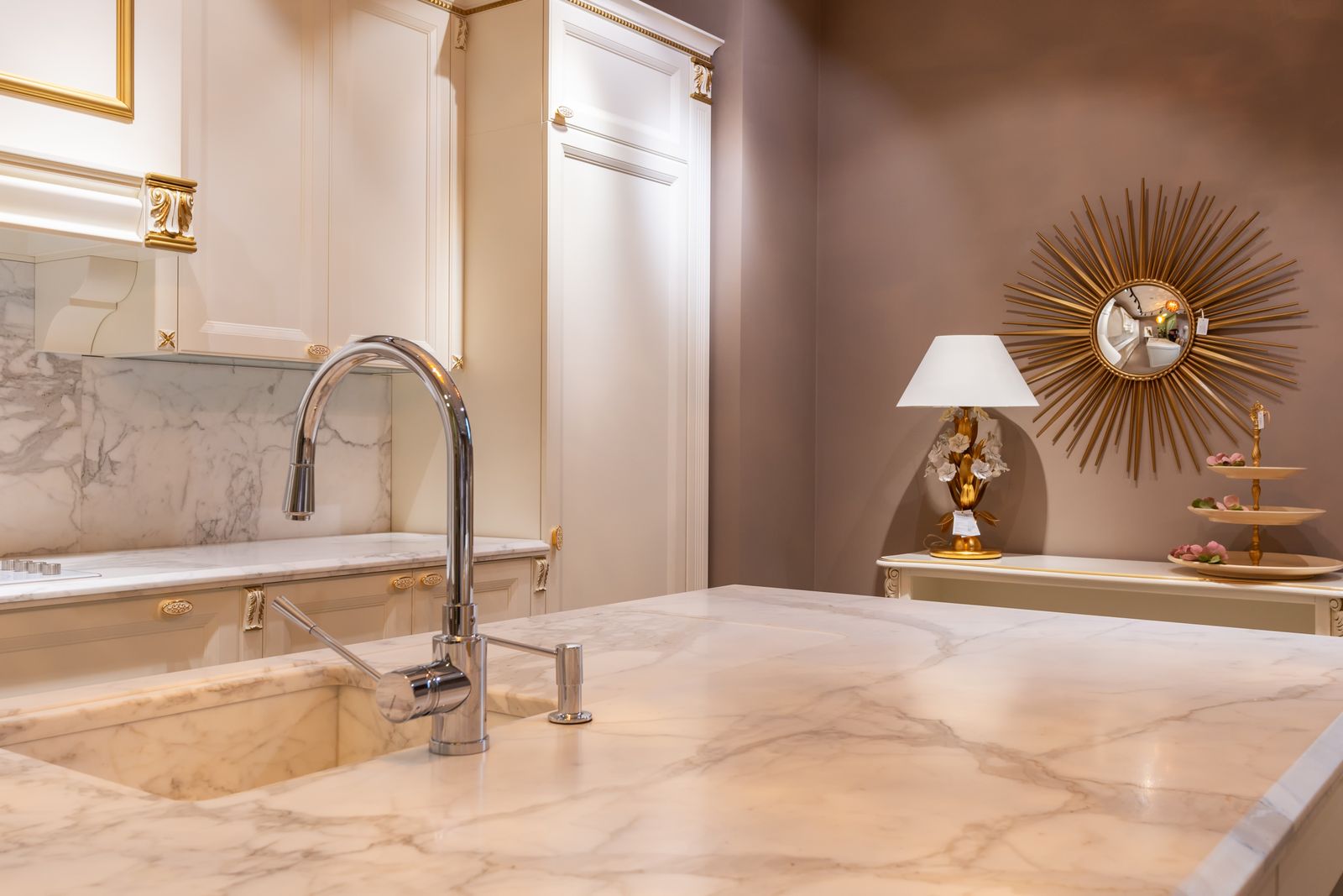 Sink and faucet on a marble kitchen counter