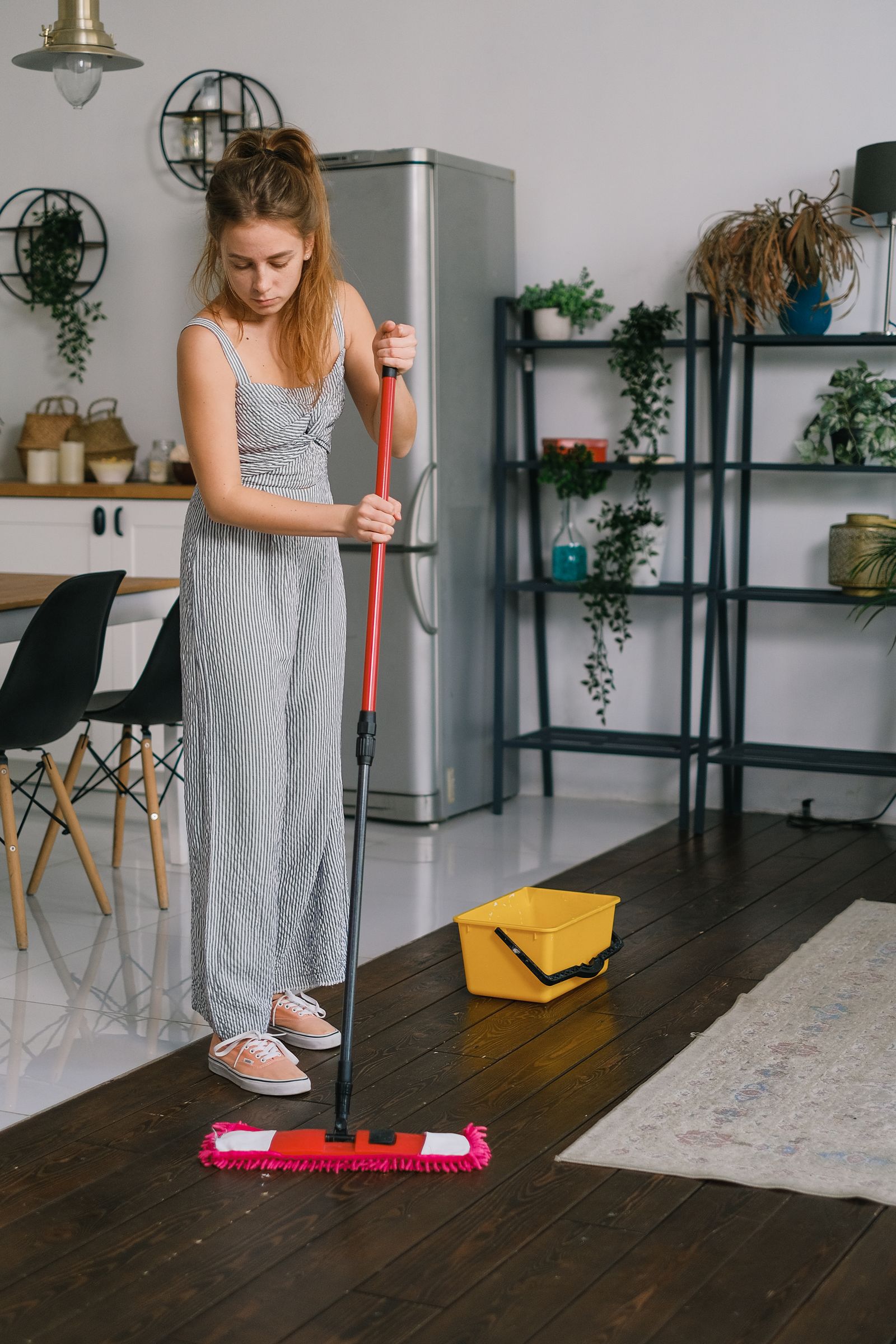 Woman mopping a wooden floor